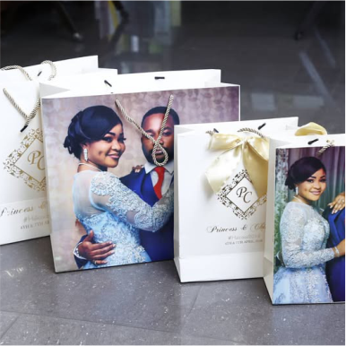 Best high top quality customized branded fashionable retractable luxury wedding shopping paper bag souvenir gift items wedding stationeries bag design and printing in Lagos, Abuja, Nigeria, Africa.