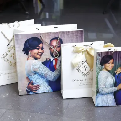 Best high top quality customized branded fashionable retractable luxury wedding shopping paper bag souvenir gift items wedding stationeries bag design and printing in Lagos, Abuja, Nigeria, Africa.