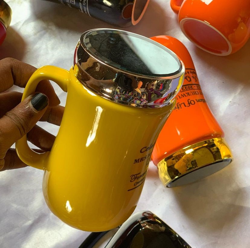High top best quality customized branded custom ceramic mirror lid mug design and printing in Lagos, Abuja, Nigeria, Africa.