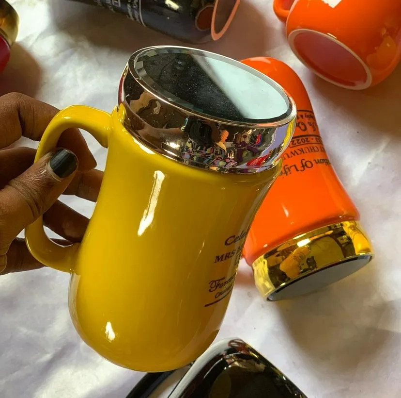 High top best quality customized branded custom ceramic mirror lid mug design and printing in Lagos, Abuja, Nigeria, Africa.