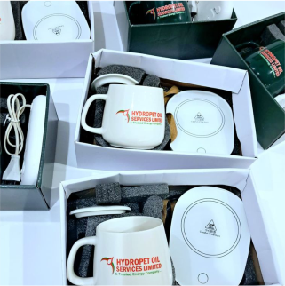 Best high top quality customized branded custom promotional retractable coffee ceramic mug with heating pad design and printing in Lagos,
                                                        Abuja, Nigeria, Africa.