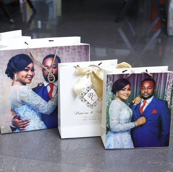 Best high top quality customized branded wedding event souvenir fashionable retractable carrier paper bag design and printing in Lagos, Abuja, Nigeria, Africa.